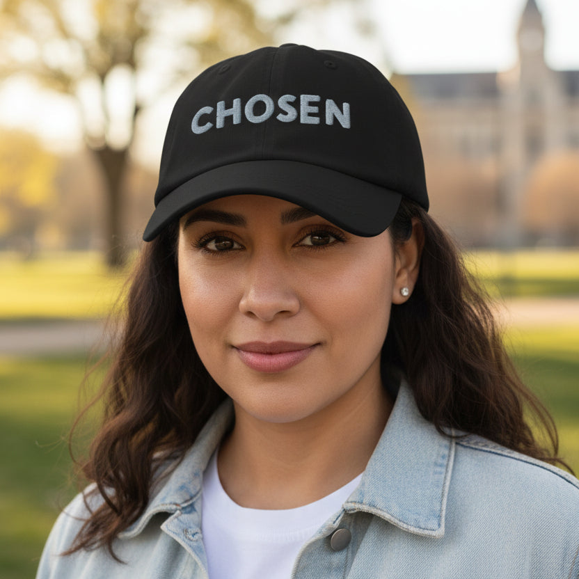 Black cap with 'Chosen' embroidered on cap, standing outside model