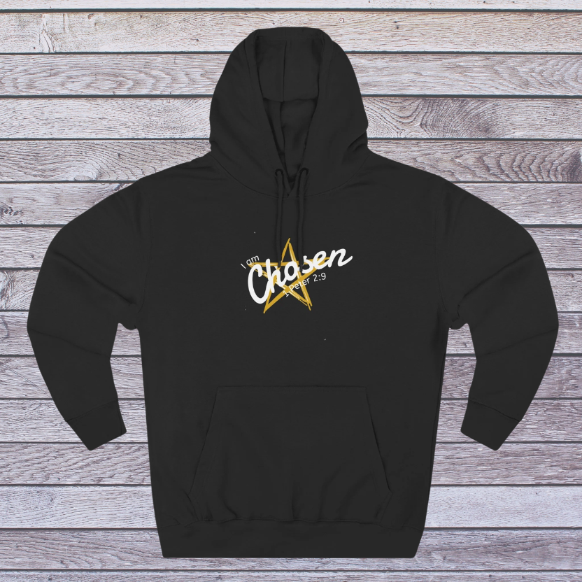 Black hoodie with 'Chosen' text and star design on a wooden background
