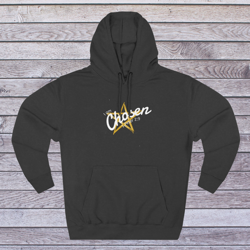 Charcoal Heather hoodie with a gold star and white text on a wooden background