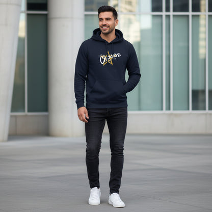 Navy blue hoodie with 'Chosen' text and star design on sidewalk in city