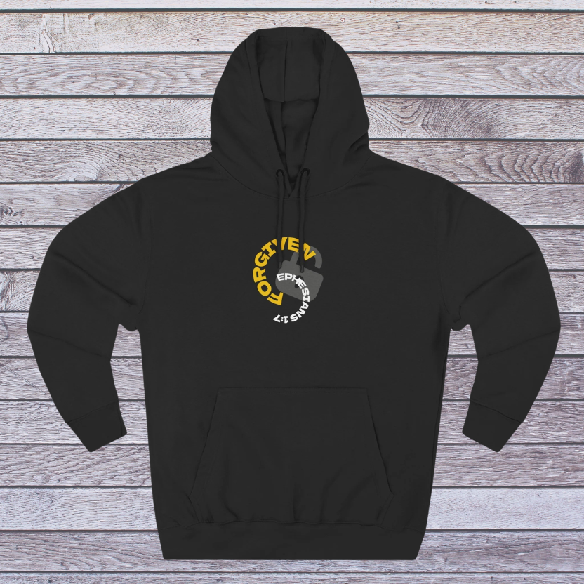 Black hoodie with a logo 'Forgiven, Ephesians 1:7' and an unlocked lock on a wooden surface