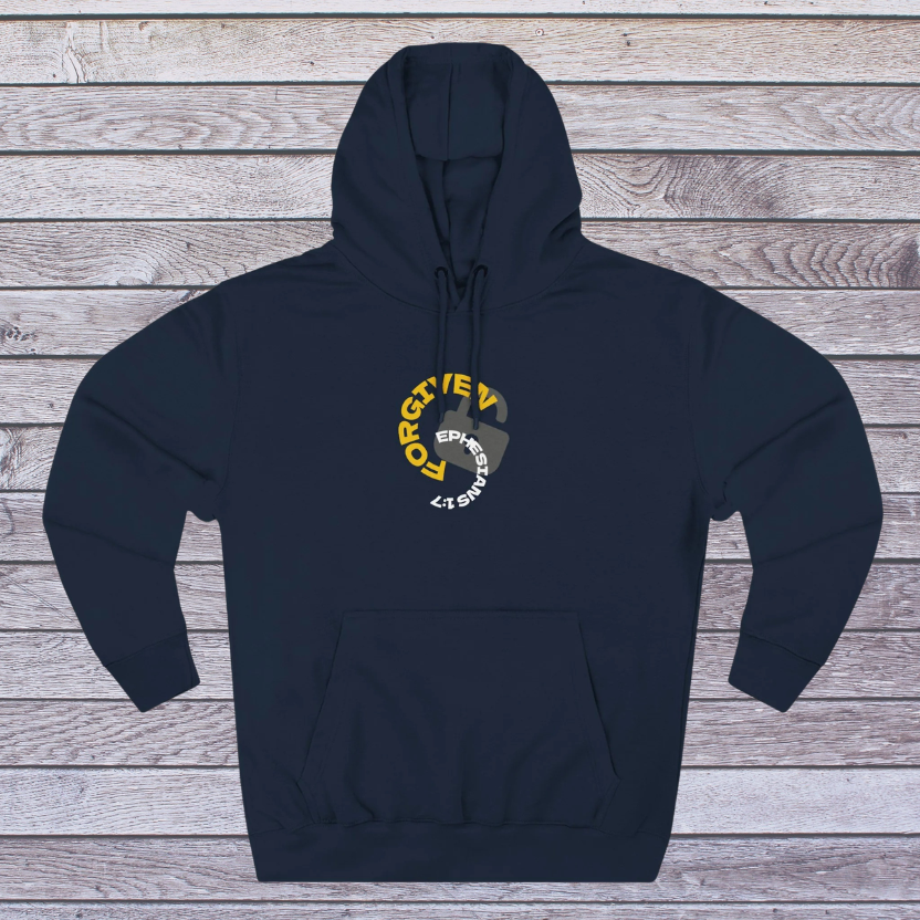 Navy hoodie with a logo on a wooden surface, 'Forgiven, Ephesians 1:7' and an unlocked lock