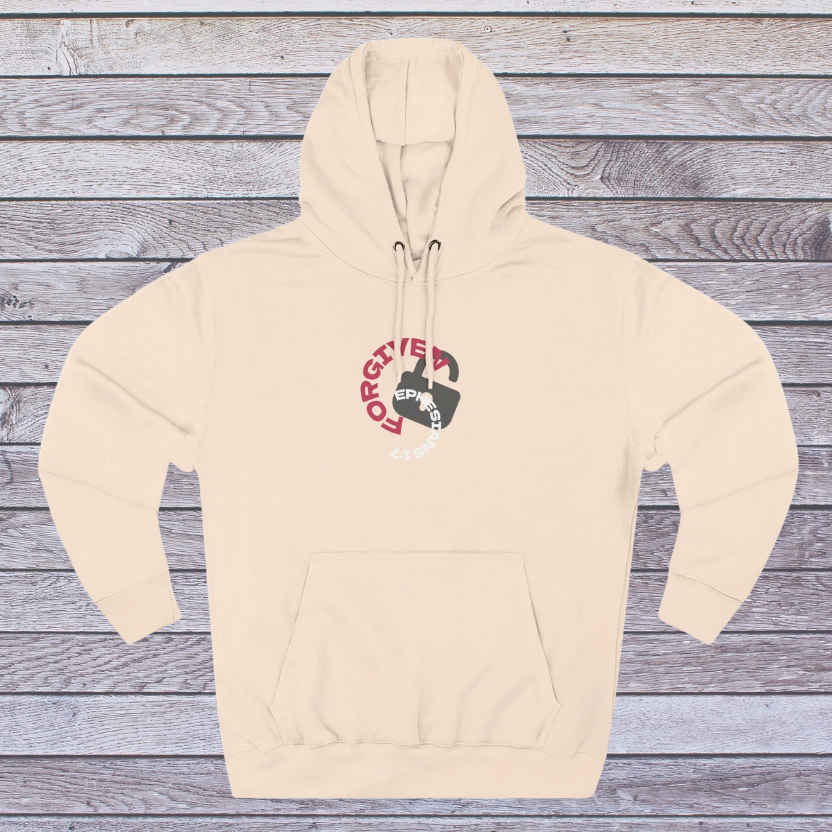 Pale Pink Beige hoodie with a graphic design on a wooden surface