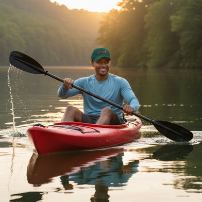 Dark green cap with 'I am free!' text in red and white out on a river kayaking