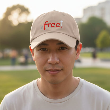Beige cap with 'I am free' text and cross symbol outside