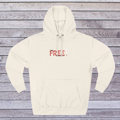 Sand shell hoodie with red text on a wooden surface, 'I am free, Galatians'