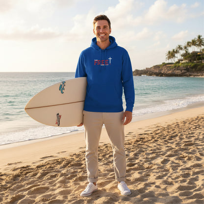 Blue hoodie with a red and white logo 'I am free, Galatians' at the beach with surfboard