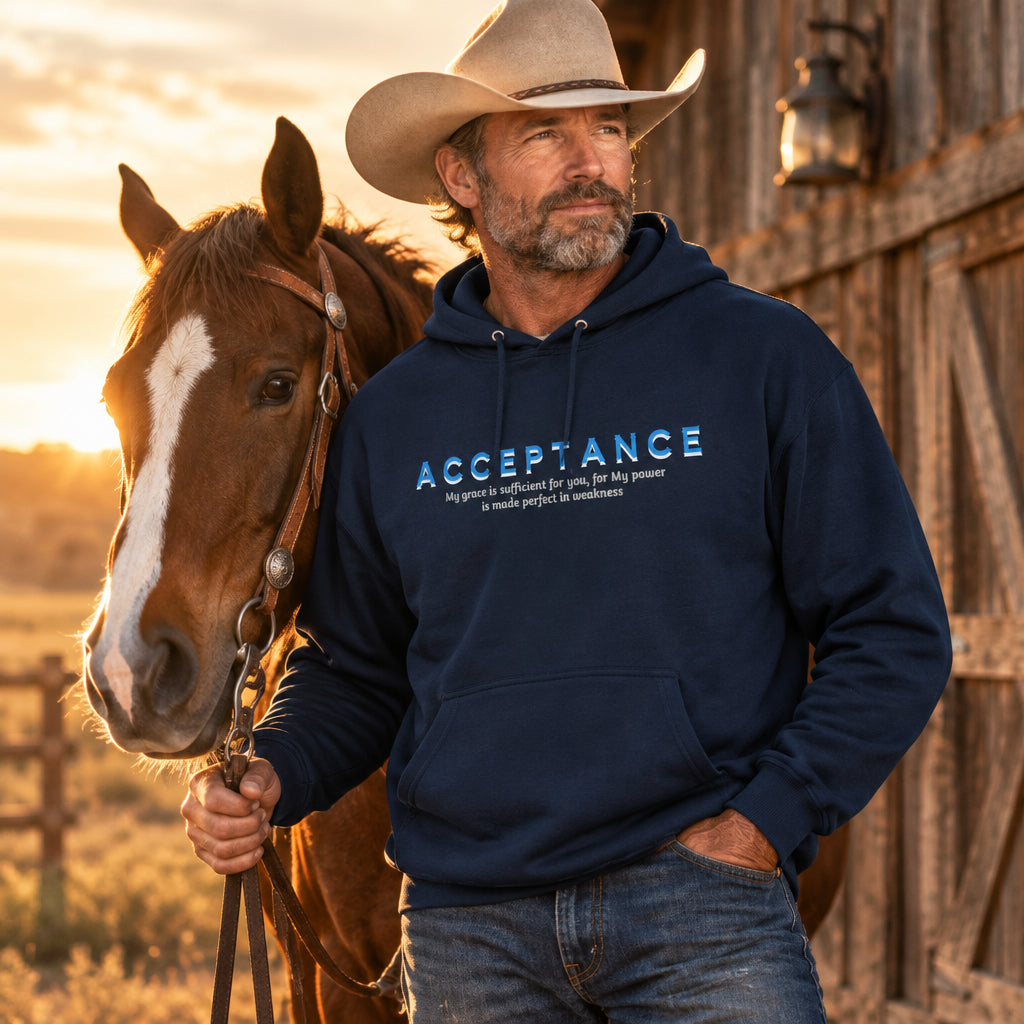 cowboy with horse and barn wearing navy blue pullover hoodie with word "acceptance"