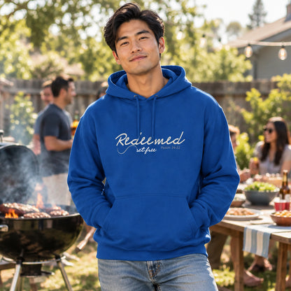 Blue hoodie with 'redeemed and set free' text 