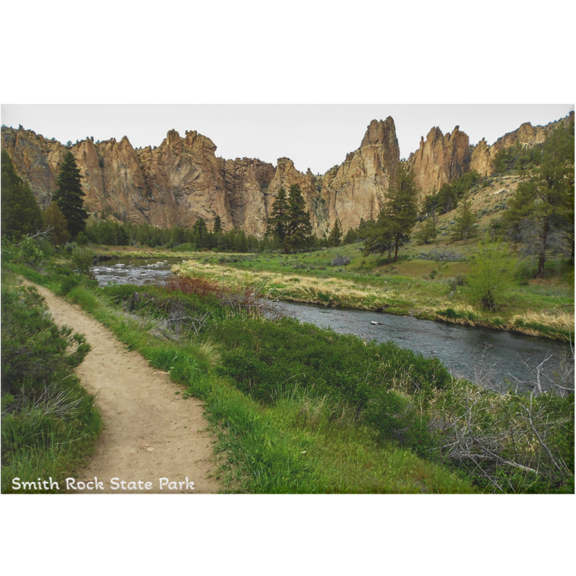 Scenic view of Smith Rock State Park with a river and rocky cliffs.
