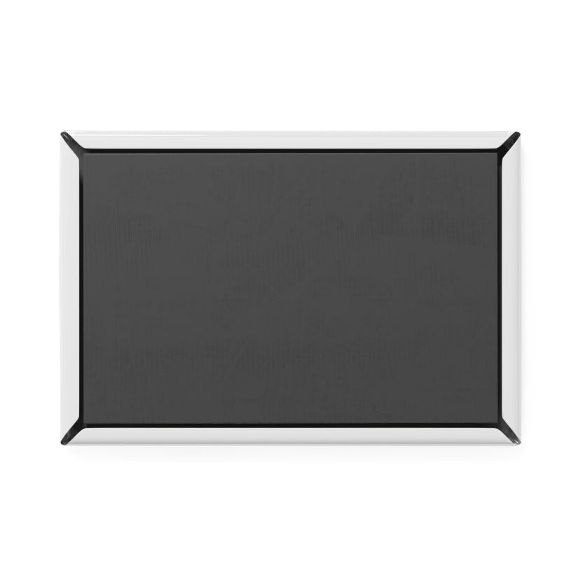 Black rectangular object with a silver border on a white background