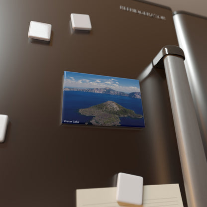 Magnet with a scenic view of a lake and mountains on a refrigerator door.