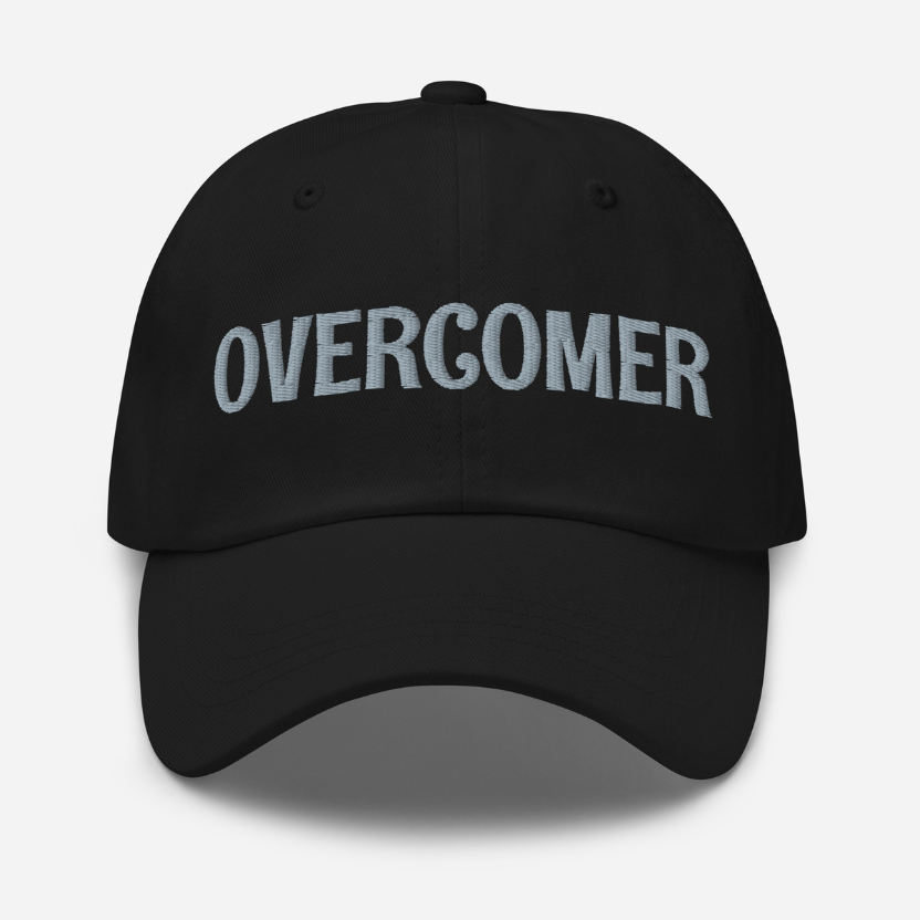 Black cap with 'Overcomer' embroidered on a white background