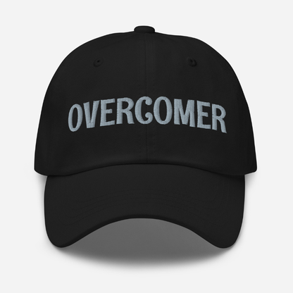 Black cap with 'Overcomer' embroidered on a white background