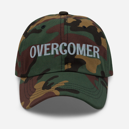 Camouflage baseball dad cap with 'OVERCOMER' text on a white background