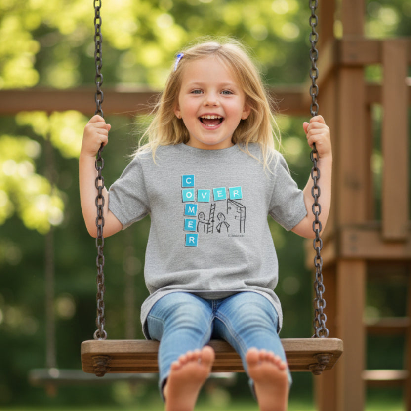 Gray t-shirt with a graphic design 'Overcomer, 1 John 5:4' on a swing