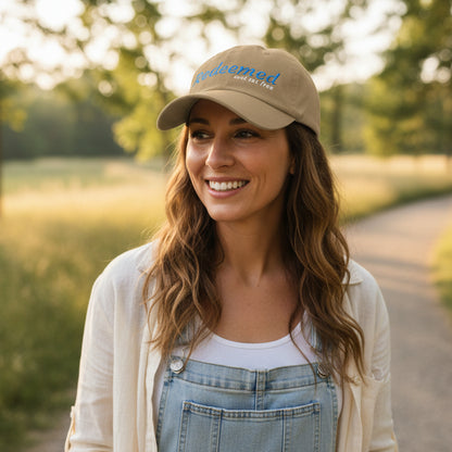 Brown cap with 'Redeemed and set free' text outside
