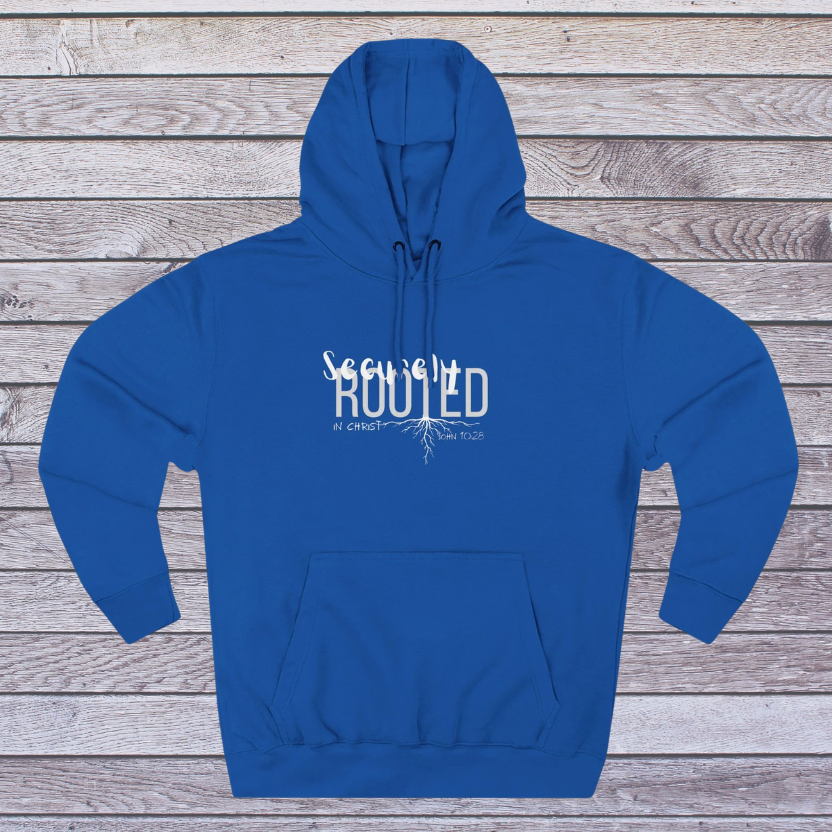 Blue hoodie with white text 'Securely Rooted' on a wooden background, Identity in Christ