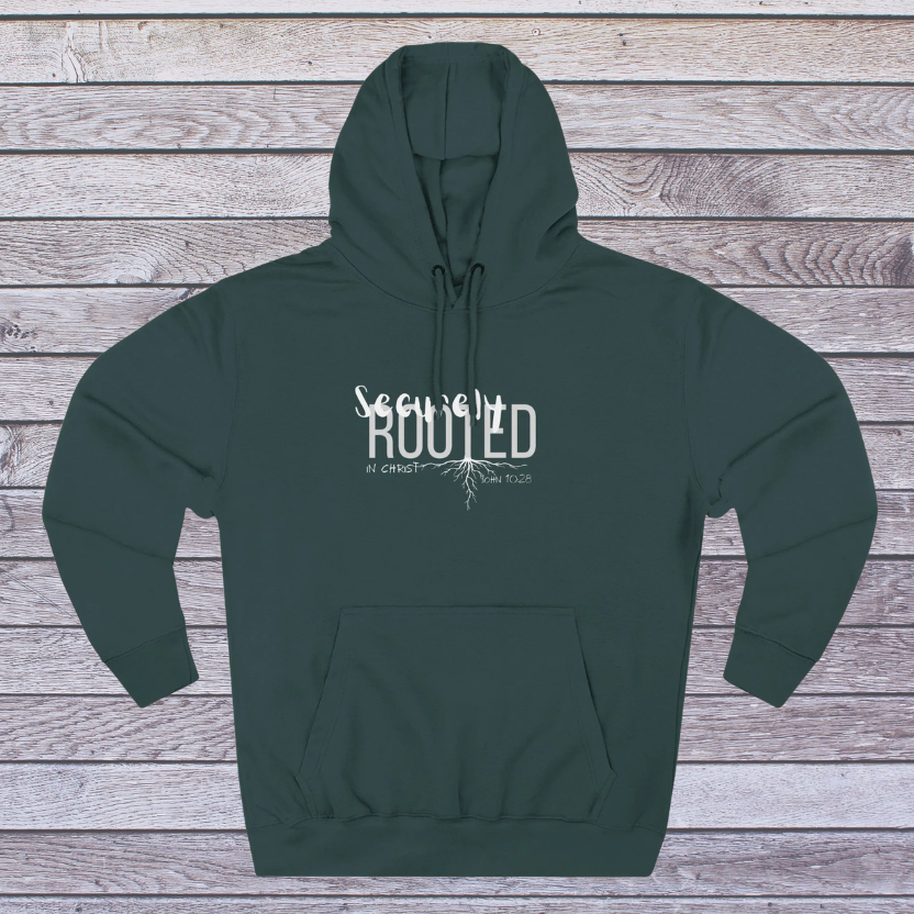 Green hoodie with white text on a wooden background