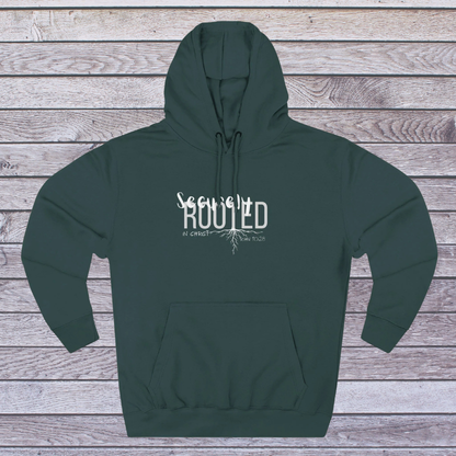 Green hoodie with white text on a wooden background