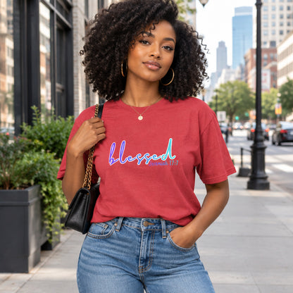 Person wearing a red t-shirt with colorful graphics 'blessed'