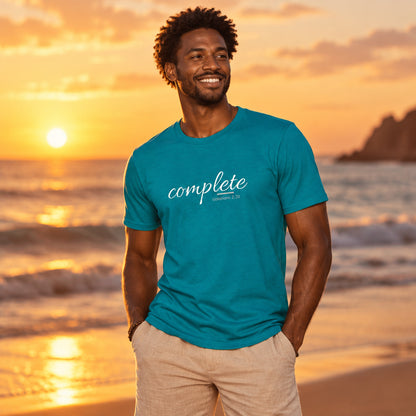 Man wearing a teal t-shirt with a graphic design 'complete'