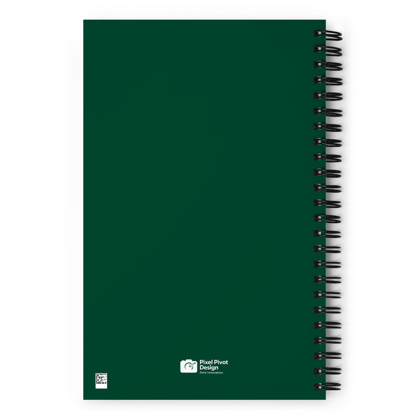 Green notebook with spiral binding on a white background