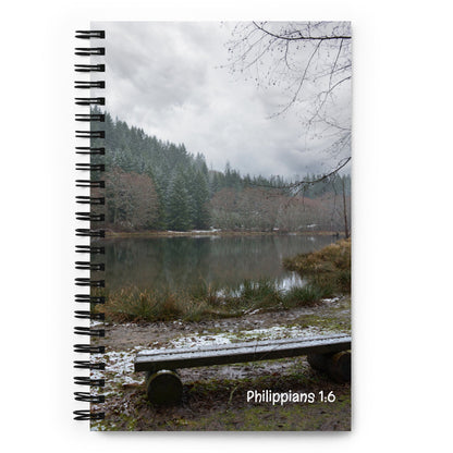 Notebook with a scenic cover featuring a lake and trees in Washington, and 'Philippians 1:6' printed on it.
