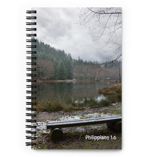 Notebook with a scenic cover featuring a lake and trees in Washington, and 'Philippians 1:6' printed on it.