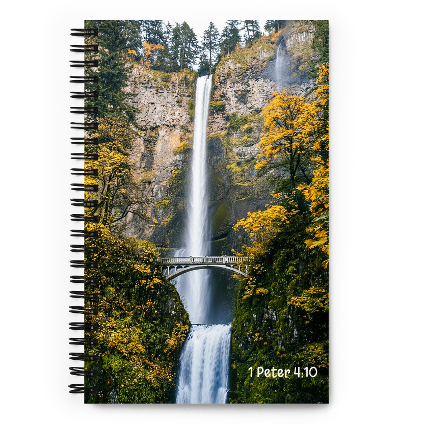 Notebook with a waterfall and forest design on the cover