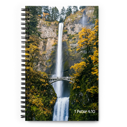 Notebook with a waterfall and forest design on the cover