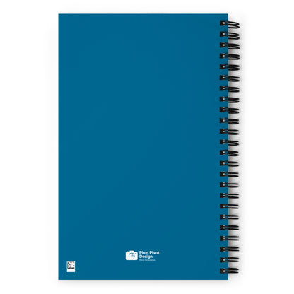 Blue notebook with spiral binding on a white background