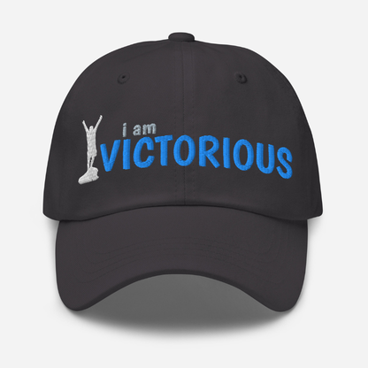 Black cap with 'i am VICTORIOUS' text and graphic on a white background