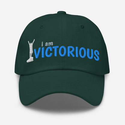 Dark green cap with 'i am VICTORIOUS' text and silhouette on a white background
