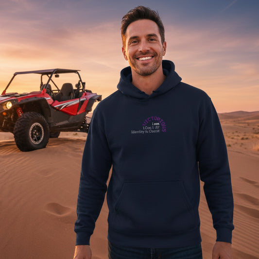 Navy blue hoodie with 'I am Victorious, 1 Corinthians 15:57, Identity in Christ' outside with dune-buggy