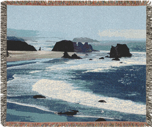 West Coast woven blanket with a scenic design of a beach and ocean.