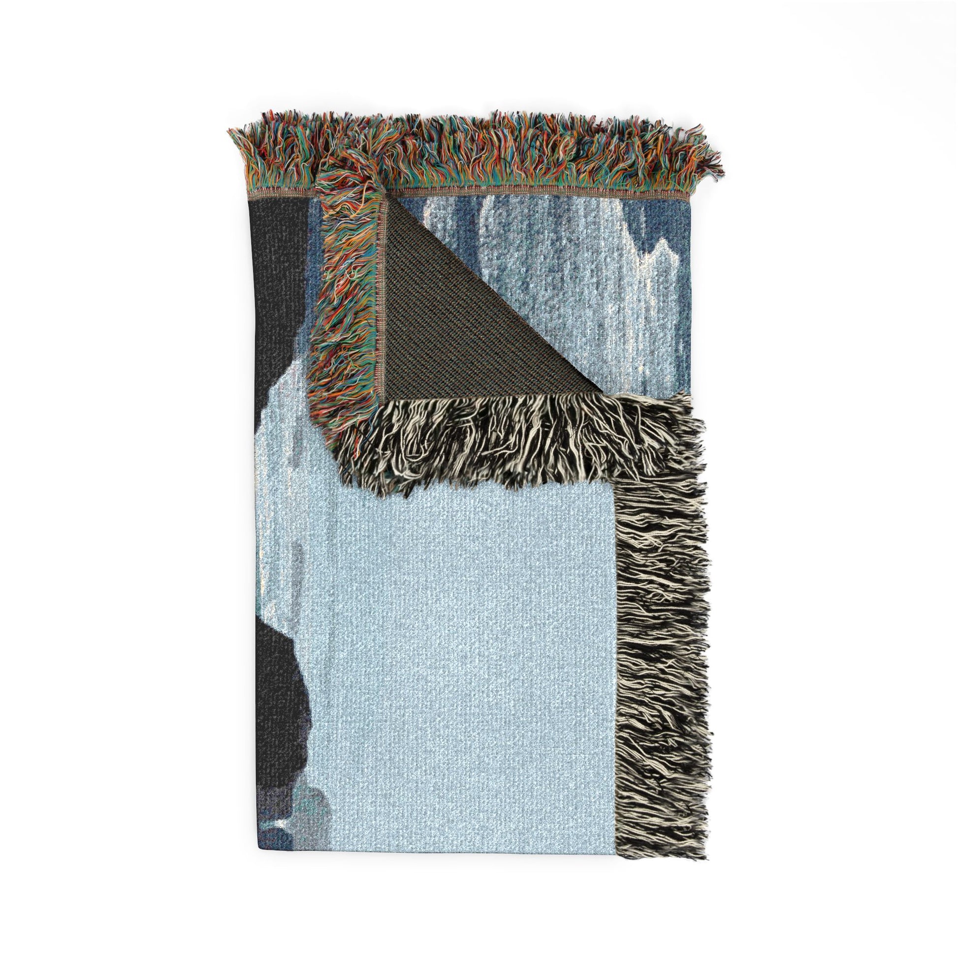 West Coast woven blanket with fringed edges, folded