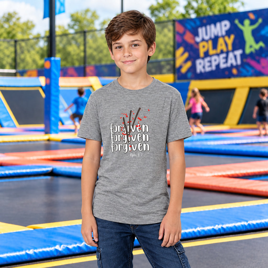 Child wearing a gray t-shirt with text and graphics "forgiven"