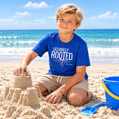 Child wearing a blue t-shirt with a graphic design "securely rooted"