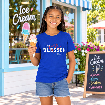 Girl wearing a blue t-shirt with a graphic design "I am blessed"
