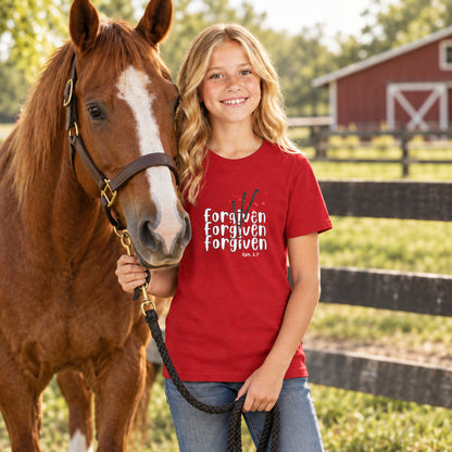 young blonde girl with red tee-shirt with design and text "forgiven, ephesians 1:7"