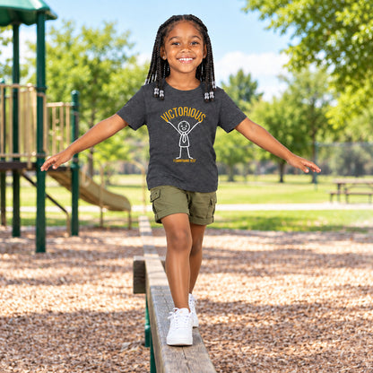 Girl wearing a gray t-shirt with a graphic design of a figure holding up the word "victorious"